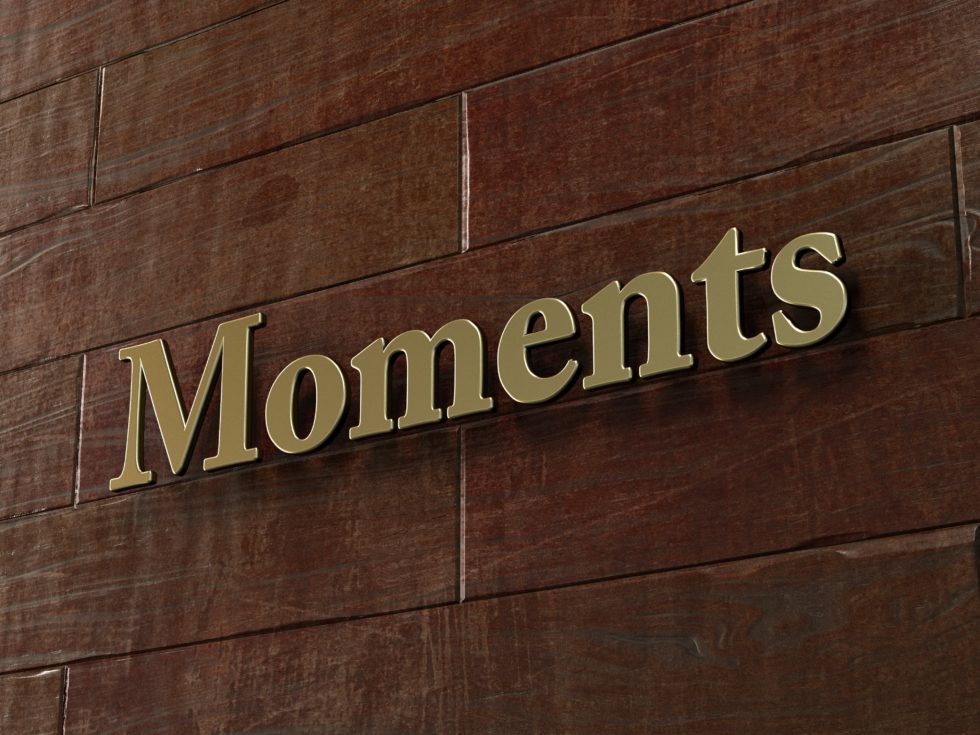 moments-bronze-plaque-mounted-on-maple-wood-wall-3d-rendered-royalty-free-stock-picture